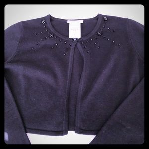 Girl’s black cardigan sweater